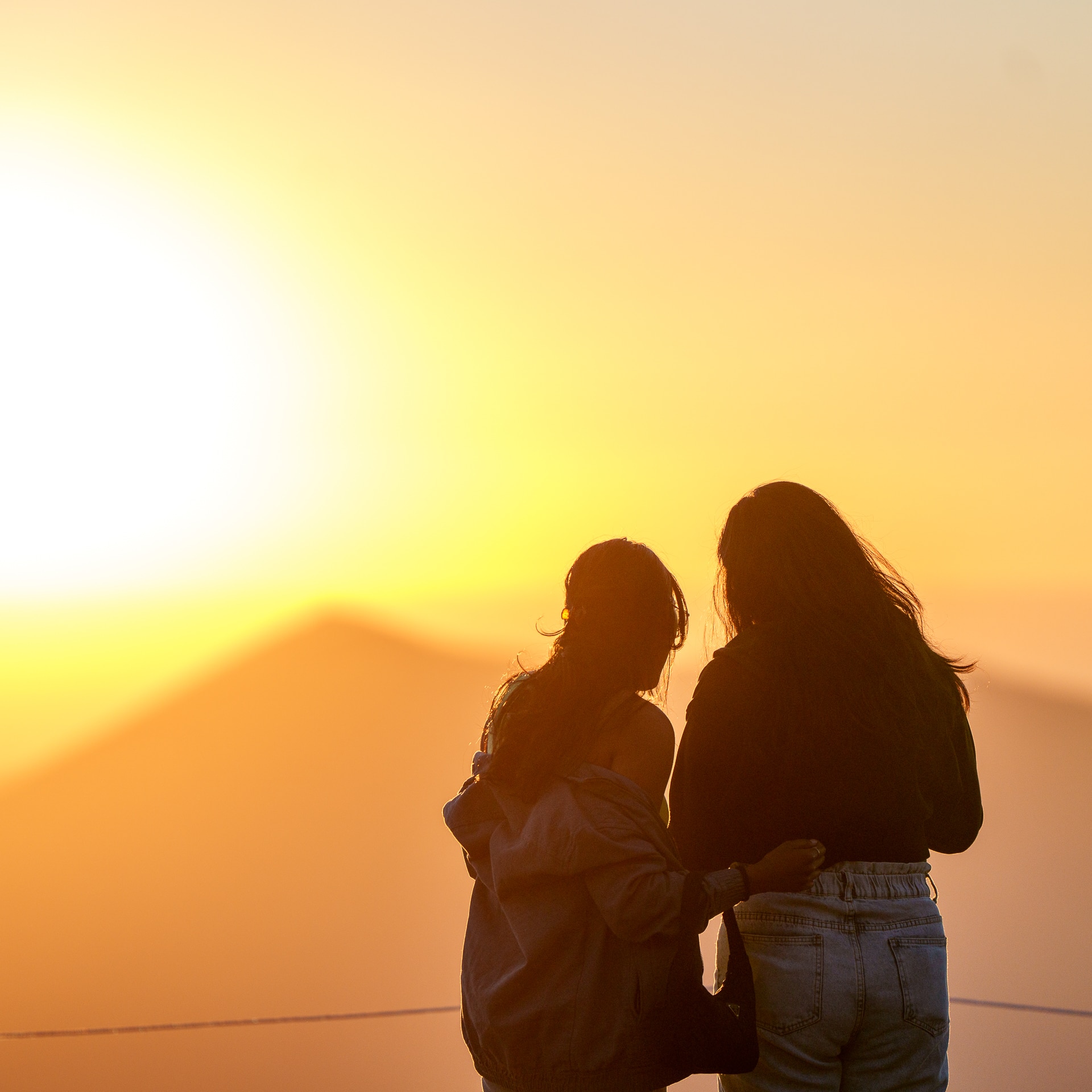 Two girls admiring sunset