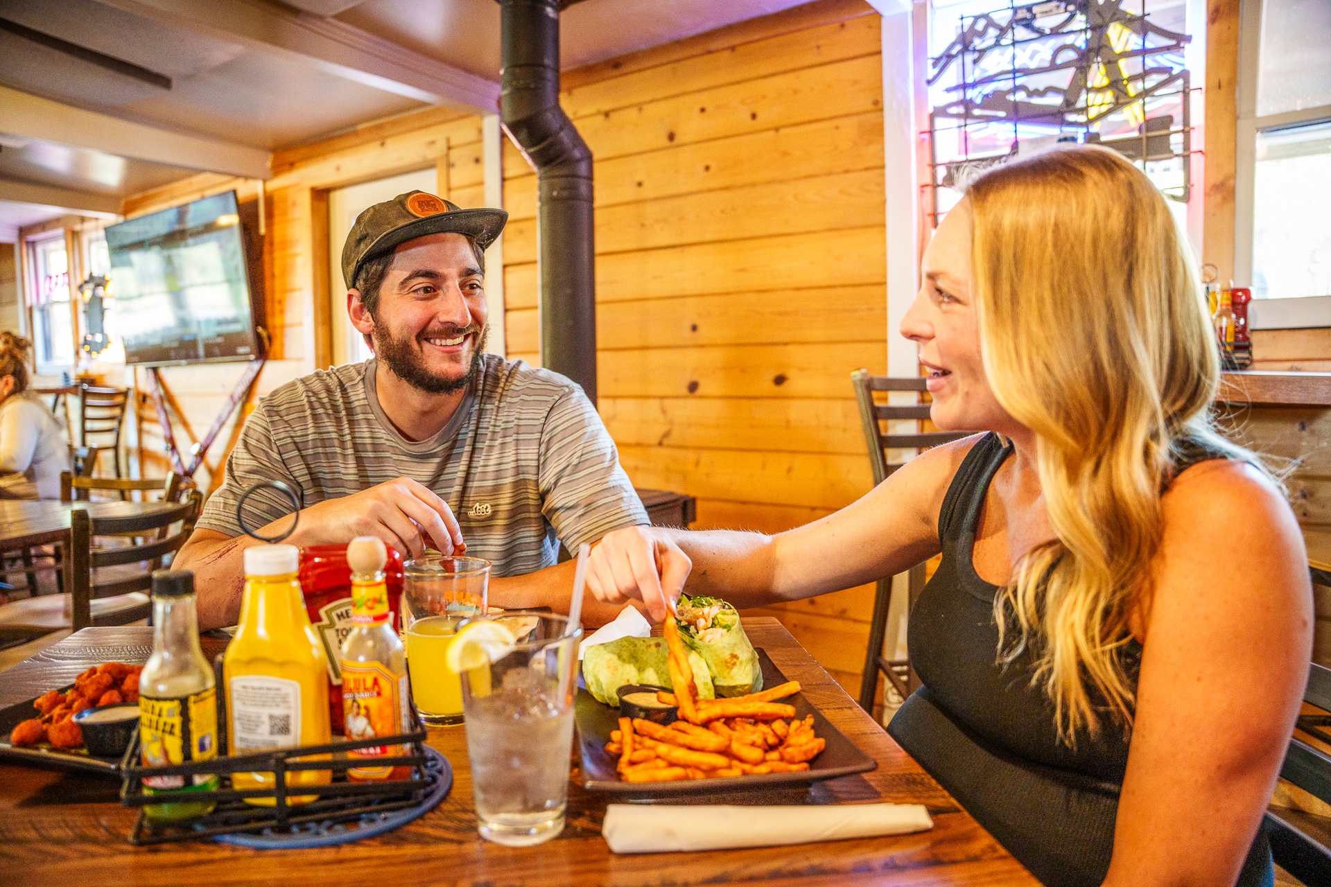 Couple enjoying a meal with each other at basecamp